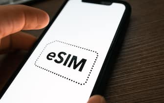 eSIM card chip logo on the smartphone screen.