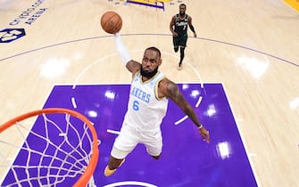 LOS ANGELES, CA - DECEMBER 13: LeBron James #6 of the Los Angeles Lakers dunks the ball during the game against the Boston Celtics on December 13, 2022 at Crypto.com Arena in Los Angeles, California. NOTE TO USER: User expressly acknowledges and agrees that, by downloading and/or using this Photograph, user is consenting to the terms and conditions of the Getty Images License Agreement. Mandatory Copyright Notice: Copyright 2022 NBAE (Photo by Adam Pantozzi/NBAE via Getty Images)