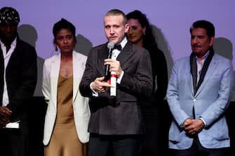 CANNES, FRANCE - MAY 24: Roberto Minervini (C) accepts the Best Director Award ex Ã¦quo for "The Damned" onstage during the Un Certain Regard closing ceremony at the 77th annual Cannes Film Festival at Palais des Festivals on May 24, 2024 in Cannes, France. (Photo by Cindy Ord/Getty Images)