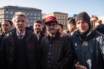 NAPLES, ITALY - FEBRUARY 12: The rap singer Emanuele Palumbo aka Geolier and the mayor of Naples Gaetano Manfredi on February 12, 2024 in Naples, Italy. The rap singer Emanuele Palumbo aka Geolier receives a plaque of thanks from the mayor of Naples Gaetano Manfredi for the success achieved at the Sanremo Festival with the Neapolitan song "I p' me, tu p' me" classified in second place. (Photo by Ivan Romano/Getty Images)