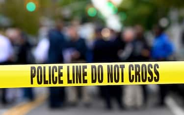 Police tape secures a crime scene outside a club after a shooting in Brooklyn on October 12, 2019. - At least four people died and three were wounded in a shooting at a social club in New York eary Saturday, police said. No one has been arrested over the shooting, which took place in Brooklyn, and the motive and exact circumstances are not known, a New York police official told AFP. The local affiliate of ABC News described the place where the shooting took place as an after-hours club. (Photo by Johannes EISELE / AFP) (Photo by JOHANNES EISELE/AFP via Getty Images)