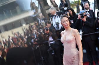 CANNES, FRANCE - MAY 25: (EDITOR'S NOTE: Image was captured in camera using a reflection on a mobile device) Elodie attends the Red Carpet of the closing ceremony at the 77th annual Cannes Film Festival at Palais des Festivals on May 25, 2024 in Cannes, France. (Photo by Vittorio Zunino Celotto/Getty Images)