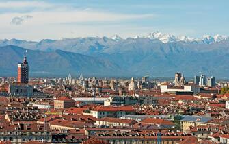 View of Turin with the mountains in background, on the left stands the Littoria Tower (1933-1934), Piedmont, Italy