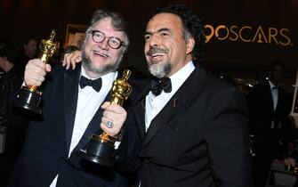 Best Director and Best Film laureate Mexican director Guillermo del Toro (L) and Mexican director Alejandro Gonzalez Inarritu attend the 90th Annual Academy Awards Governors Ball at the Hollywood & Highland Center on March 4, 2018, in Hollywood, California. / AFP PHOTO / ANGELA WEISS        (Photo credit should read ANGELA WEISS/AFP via Getty Images)