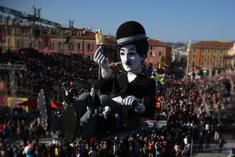 A picture taken with a tilt and shift lens shows a float with a giant effigy of Charlie Chaplin parading during the Nice carnival parade on February 24, 2019 in Nice, southeastern France. (Photo by VALERY HACHE / AFP) (Photo by VALERY HACHE/AFP via Getty Images)