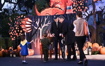 US President Joe Biden hands out candy to US Secretary of State Antony Blinken's children during a Halloween celebration on the South Lawn of the White House in Washington, DC, on October 30, 2023. (Photo by Brendan SMIALOWSKI / AFP) (Photo by BRENDAN SMIALOWSKI/AFP via Getty Images)