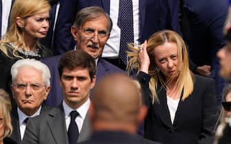 MILAN, ITALY - JUNE 14:  President of Italy Sergio Mattarella, Ignazio La Russa President of Senate and Italian Prime Minister Giorgia Meloni attend the state funeral for Silvio Berlusconi on June 12, 2023 in Milan, Italy. Former Italian Prime Minister who bounced back from a series of scandals, died on June 12, 2023 at age 86. His state funeral takes place on June 14, and a national day of mourning has been announced. The politician and businessman, at the time of his death, had the third largest fortune in Italy. According to media estimates, his net worth was between 6 and 7 billion dollars. (Photo by Pier Marco Tacca/Getty Images)