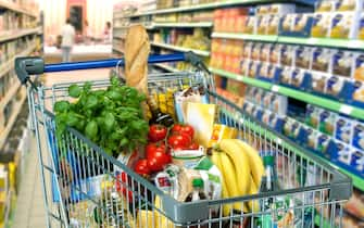 Food in a shopping trolley in a supermarket.