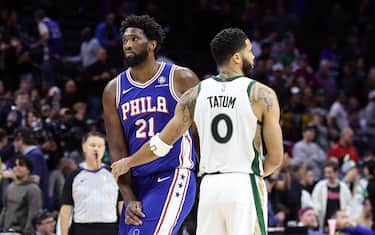 PHILADELPHIA, PENNSYLVANIA - NOVEMBER 15: Joel Embiid #21 of the Philadelphia 76ers and Jayson Tatum #0 of the Boston Celtics embrace after the Celtics defeated the 76ers at the Wells Fargo Center on November 15, 2023 in Philadelphia, Pennsylvania. NOTE TO USER: User expressly acknowledges and agrees that, by downloading and or using this photograph, User is consenting to the terms and conditions of the Getty Images License Agreement. (Photo by Tim Nwachukwu/Getty Images)