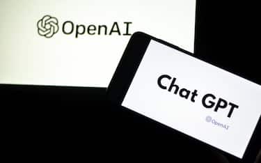 Photo illustration showing ChatGPT and OpenAI research laboratory logo and inscription at a mobile phone smartphone screen with a blurry background. Open AI is an app using artificial intelligence technology. Italy is the first European country to ban and block the robot Chat GPT application and website. ChatGPT is an artificial-intelligence (AI) chatbot developed by OpenAI and launched in November 2022 using reinforcement learning techniques both from machine and human feedback. Tunis, Tunisia on April 02, 2023. (Photo by Yassine Mahjoub/SIPA) //MAHJOUBYASSINE_MAHJOUB0339/Credit:Yassine Mahjoub/SIPA/2304030848
