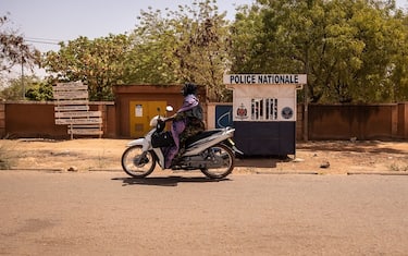 A woman rides a motorcycle in Ouagadougou, on March 2, 2023. (Photo by OLYMPIA DE MAISMONT / AFP) (Photo by OLYMPIA DE MAISMONT/AFP via Getty Images)
