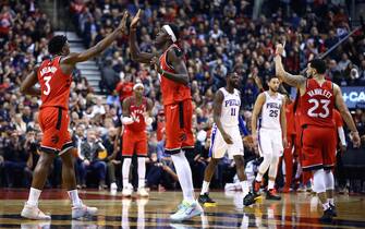 TORONTO, ON - NOVEMBER 25:  Pascal Siakam #43 of the Toronto Raptors high fives OG Anunoby #3 during the second half against the Philadelphia 76ers at Scotiabank Arena on November 25, 2019 in Toronto, Canada.  NOTE TO USER: User expressly acknowledges and agrees that, by downloading and or using this photograph, User is consenting to the terms and conditions of the Getty Images License Agreement.  (Photo by Vaughn Ridley/Getty Images)