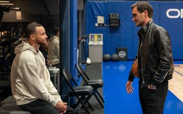 SAN FRANCISCO, CALIFORNIA - MARCH 9: Roger Federer speaks with Stephen Curry of the Golden State Warriors before a game while promoting the Laver Cup San Francisco Launch for 2025 at Chase Center on March 9, 2024 in San Francisco, California. (Photo by Loren Elliott/Getty Images for Laver Cup)