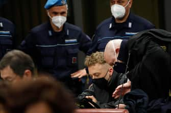 Finnegan Lee Elder, left, listens to his lawyer Renato Borzone at the end of a hearing in the trial where they are accused of slaying the Carabinieri paramilitary police officer Mario Cerciello Rega, while on vacation in Italy in July 2019, in Rome, Saturday, March 6, 2021.
ANSA/AP Photo/Alessandra Tarantino, Pool