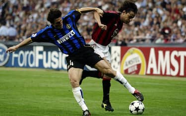 MILAN - MAY 7:  Filippo Inzaghi of AC Milan is tackled by Javier Zanetti of Inter Milan during the UEFA Champions League Semi-Final First Leg match between AC Milan and Internazionale Milano held on May 7, 2003 at the Guiseppe Meazza San Siro, in Milan, Italy. The match ended in a 0-0 draw. (Photo by Clive Brunskill/Getty Images)