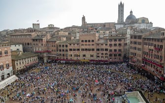 Spectators leave after the announcement that the historical horse race 'Palio di Siena' has been postponed to 17 August due to the rain in Siena, Italy, 16 August 2024. The traditional horse race takes place on 16 August as the 'Palio dell'Assunta' during the holidays for the Assumption of Mary.
ANSA/CLAUDIO GIOVANNINI