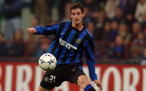 Inter Milan's Jeremie Brechet and Arsenal's Thierry Henry battle for the ball