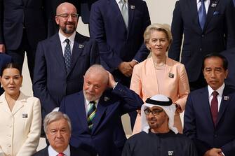 DUBAI, UNITED ARAB EMIRATES - DECEMBER 01: European Union President Ursula von der Leyen (2R) and Indonesian President Joko Widodo (R) prepare for a family photo during day one of the high-level segment of the UNFCCC COP28 Climate Conference at Expo City Dubai on December 01, 2023 in Dubai, United Arab Emirates. The COP28, which is running from November 30 through December 12, brings together stakeholders, including international heads of state and other leaders, scientists, environmentalists, indigenous peoples representatives, activists and others to discuss and agree on the implementation of global measures towards mitigating the effects of climate change. (Photo by Sean Gallup/Getty Images)