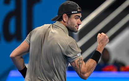 Italy's Matteo Berettin reacts after a point against Serbia's Novak Djokovic during their men's singles match at the ATP Qatar Open tennis tournament in Doha on February 18, 2025. (Photo by Mahmud HAMS / AFP)