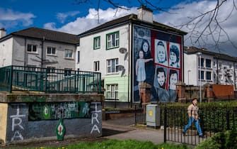 Murals on the side of houses in the Bogside area of Londonderry, also known as Derry, Northern Ireland, UK, on Monday, April 10, 2023. US President Joe Biden will visit Northern Ireland and the Republic of Ireland to coincide with the 25th anniversary of the signing of the Good Friday Agreement. Photographer: Chris J. Ratcliffe/Bloomberg