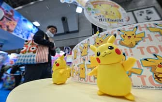 A visitor walks past a Pokemon display at the booth by Japanese company Takara Tomy, on the first day of the four-day 2023 International Tokyo Toy Show at Tokyo Big Sight in the Japanese capital on June 8, 2023. (Photo by Richard A. Brooks / AFP) (Photo by RICHARD A. BROOKS/AFP via Getty Images)