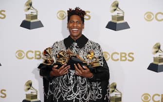 epa09869541 Jon Batiste poses in the press room with his Grammys for Album of the Year 'We Are',  Best American Roots Song 'Cry', Best American Roots Performance 'Cry', for Best Music Video 'Freedom', Best Score Soundtrack for Visual Media 'Soul', during the 64th annual Grammy Awards at the MGM Grand Garden Arena in Las Vegas, Nevada, USA, 03 April 2022.  EPA/ETIENNE LAURENT