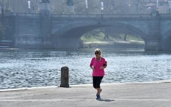 People enjoy the sunny day jogging in the Murazzi area, the landing places, the arches and the boathouses located on the west bank of the Po, the longest Italian river, near the historic center of Turin. Italy has reported at least 35,713 confirmed cases of the COVID-19 disease caused by the SARS-CoV-2 coronavirus and 2,978 deaths so far. The Mediterranean country remains in total lockdown as the pandemic disease spreads through Europe.  ANSA/ALESSANDRO DI MARCO