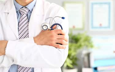 Physician holding stethoscope
