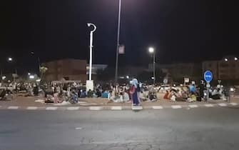 This frame grab from video footage taken by AFPTV shows people out in the open in Marrakesh September 9, 2023, following a 6.8 magnitude earthquake that struck Morocco. Nearly 300 people have died after a powerful earthquake rattled Morocco Friday night, according to a preliminary government count, as terrified residents of Marrakesh reported "unbearable" screams followed the 6.8-magnitude tremor. (Photo by Faisal Baddour / AFPTV / AFP) (Photo by FAISAL BADDOUR/AFPTV/AFP via Getty Images)