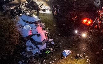 Aerial view of the wreckage of an airplane that crashed with 61 people on board in Vinhedo, Sao Paulo State, Brazil, on August 9, 2024. An airplane carrying 57 passengers and four crew crashed on August 9 in Brazil's Sao Paulo state, killing everyone on board, local officials said. The aircraft, a French-made ATR 72-500 operated by the airline Voepass, was travelling from Cascavel in southern Parana state to Sao Paulo's Guarulhos international airport when it crashed in the city of Vinhedo. (Photo by MIGUEL SCHINCARIOL / AFP)