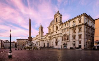 Piazza Navona, located in Rome, Italy, is a popular public square featuring the famous Fontana dei Quattro Fiumi or Fountain of the Four Rivers built in 1651 by Gian Lorenzo Bernini. Also, facing onto the piazza is the 17th-century Baroque church Sant'Agnese in Agone which was completed in 1859.