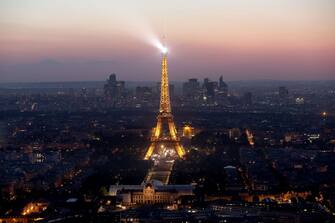 PARIS, FRANCE - JULY 07: The Eiffel Tower stands illuminated after sunset on July 07, 2023 in Paris, France. Paris will host the Summer Olympics from July 26 till August 11, 2024. (Photo by Alexander Hassenstein/Getty Images)