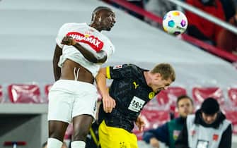 11 November 2023, Baden-Württemberg, Stuttgart: Soccer: Bundesliga, VfB Stuttgart - Borussia Dortmund, Matchday 11, MHPArena. Stuttgart's Serhou Guirassy (l) in action against Dortmund's Julian Ryerson (r). Photo: Tom Weller/dpa - IMPORTANT NOTE: In accordance with the regulations of the DFL German Football League and the DFB German Football Association, it is prohibited to utilize or have utilized photographs taken in the stadium and/or of the match in the form of sequential images and/or video-like photo series.