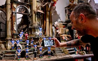 The terracotta statuettes of the Napoli players make up the 'blue nativity scene' created for the upcoming ''Scudetto party'' by the craftsman of San Gregorio Armeno Genny Di Virgilio, in Naples, Italy, 28 April 2023. SSC Napoli lead the Serie A, continuing their seemingly unstoppable march towards the title. ANSA / CIRO FUSCO