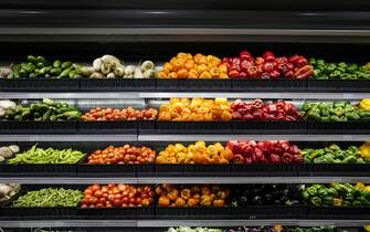 Organic produce in grocery store shelf, Vegetables For Sale In Market.