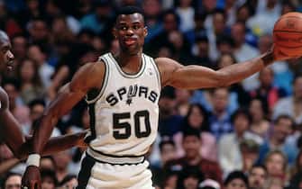 SAN ANTONIO - 1994: David Robinson #50 of the San Antonio Spurs handles the ball against the Orlando Magic circa 1994 at the Alamo Dome in San San Antonio, Texas. NOTE TO USER: User expressly acknowledges and agrees that, by downloading and or using this photograph, User is consenting to the terms and conditions of the Getty Images License Agreement. Mandatory Copyright Notice: Copyright 1994 NBAE (Photo by Nathaniel S. Butler/NBAE via Getty Images)