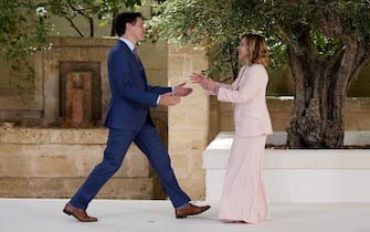 FASANO, ITALY - JUNE 13: Canadian Prime Minister Justin Trudeau is greeted by Italian Prime Minister Giorgia Meloni during a welcome ceremony on day one of the 50th G7 summit at Borgo Egnazia on June 13, 2024 in Fasano, Italy. The G7 summit in Puglia, hosted by Italian Prime Minister Giorgia Meloni, the seventh held in Italy, gathers leaders from the seven member states, the EU Council, and the EU Commission. Discussions will focus on topics including Africa, climate change, development, the Middle East, Ukraine, migration, Indo-Pacific economic security, and artificial intelligence. (Photo by Christopher Furlong/Getty Images)