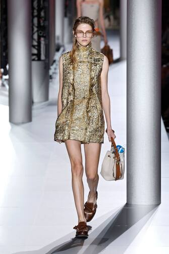 PARIS, FRANCE - OCTOBER 3: (EDITORIAL USE ONLY - For Non-Editorial use please seek approval from Fashion House) A model walks the runway during the Miu Miu Womenswear Spring/Summer 2024 show as part of Paris Fashion Week on October 3, 2023 in Paris, France. (Photo by Estrop/Getty Images)