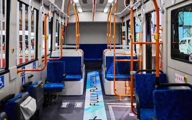The interior of an Isuzu Motors Ltd. ERGA EV flat-floor route bus on display during the Japan Mobility Show in Tokyo, Japan, on Thursday, Oct. 26, 2023. Japan's carmakers are staging their first motor show in four years to make the case they'll remain major global forces to be reckoned with in the electric-vehicle age. Photographer: Shoko Takayasu/Bloomberg via Getty Images