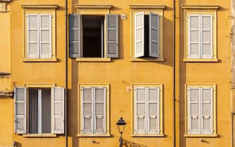 Colorful house facades in Piazza XX Settembre, Modena.