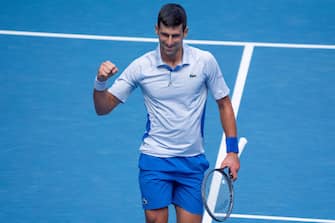 MELBOURNE, AUSTRALIA - JANUARY 26: Novak Djokovic of Serbia celebrates a point in his semifinal singles match against Jannik Sinner of Italy during day thirteen of the 2024 Australian Open at Melbourne Park on January 26, 2024 in Melbourne, Australia. (Photo by Andy Cheung/Getty Images)