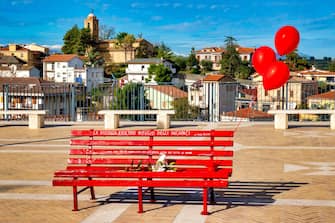 A bench painted red for the International Day for the Elimination of Violence against Women (November 25) in Piazza dei Vestini, Pianella, Italy