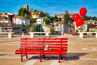 A bench painted red for the International Day for the Elimination of Violence against Women (November 25) in Piazza dei Vestini, Pianella, Italy