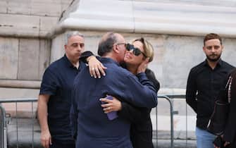MILAN, ITALY - JUNE 14: Ex girlfriend of Silvio Berlusconi Francesca Pascale and singer Mariano Apicella are seen in front of the Duomo cathedral in Milan ahead of the state funeral for Italy's former prime minister and media tycoon Silvio Berlusconi on June 14, 2023 in Milan, Italy. Silvio Berlusconi, the former Italian Prime Minister who bounced back from a series of scandals, died on June 12, 2023 at age 86. His state funeral takes place on June 14, and a national day of mourning has been announced. The politician and businessman, at the time of his death, had the third largest fortune in Italy. According to media estimates, his net worth was between 6 and 7 billion dollars. (Photo by Ernesto Ruscio/Getty Images)