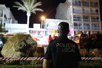 PALMA DE MALLORCA, MALLORCA, BA, SPAIN - MAY 23: A local policeman in front of a collapsed building, in Playa de Palma, on 23 May, 2024 in Palma de Mallorca, Mallorca, Balearic Islands, Spain. At least two people have died Thursday in the collapse of a building in Playa de Palma, as reported by 112 on the social network X where it also indicates that there would be between 12 and 14 injured of varying degrees. (Photo By Isaac Buj/Europa Press via Getty Images)