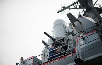 A sailor conducts maintenance on the Phalanx CIWS close-in weapon system aboard the Arleigh Burke-class guided missile destroyer USS Stout at Naval Station Norfolk in Norfolk, Virginia, May 8, 2013, during the Department of Defense's tour deemed Navy 101.  AFP PHOTO/JIM  WATSON        (Photo credit should read JIM WATSON/AFP via Getty Images)