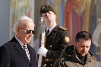 US President Joe Biden (L) walks next to Ukrainian President Volodymyr Zelensky (R) past a religious mural at the St. Michael s Golden-Domed Cathedral, as he arrives for a visit in Kyiv on February 20, 2023. - US President Joe Biden made a surprise trip to Kyiv on February 20, 2023, ahead of the first anniversary of Russia's invasion of Ukraine, AFP journalists saw. Biden met Ukrainian President Volodymyr Zelensky in the Ukrainian capital on his first visit to the country since the start of the conflict. (Photo by Dimitar DILKOFF / AFP)