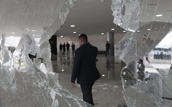 epa10396799 Officials inspect the damage to the Planalto Palace after Bolsonaro supporters took over the Plaza de los Tres Poderes (Square of the Three Powers) to invade government buildings, in Brasilia, Brazil, 09 January 2023. Hundreds of supporters of former Brazilian President Jair Bolsonaro on 08 January invaded the headquarters of the National Congress, and also Supreme Court and the Planalto Palace, seat of the Presidency of the Republic, in a demonstration calling for a military intervention to overthrow President Luiz Inacio Lula da Silva. The crowd broke through the cordons of security forces and forced their way to the roof of the buildings of the Chamber of Deputies and the Senate, and some entered inside the legislative headquarters. So far, authorities detained some people involved in the violent acts which were widely condemned by all Brazilian institutions and by the international community.  EPA/ANDRE COELHO