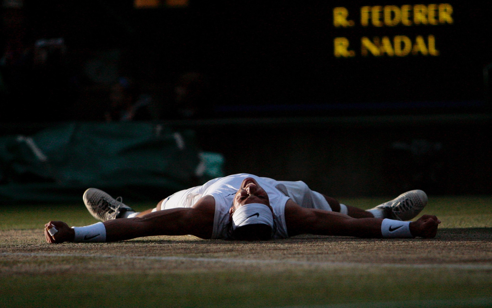 epa11652129 (FILE) - Rafael Nadal of Spain celebrates his victory over Roger Federer of Switzerland in their men's final for the Wimbledon Championships at the All England Lawn Tennis Club, in London, Britain, 06 July 2008 (reissued 10 October 2024). On 10 October 2024, Rafael Nadal of Spain announced that he will retire from professional tennis. Since winning his first ever title in 2004, Nadal won 92 titles, including 22 grand slams and a record 14 French Open titles.  EPA/HUGO PHILPOTT EDITORIAL USE ONLY/NO COMMERCIAL SALES *** Local Caption *** 01406470