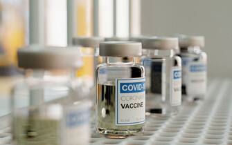 Close-up of a covid-19 vaccine flasks for tests on a medical shelf